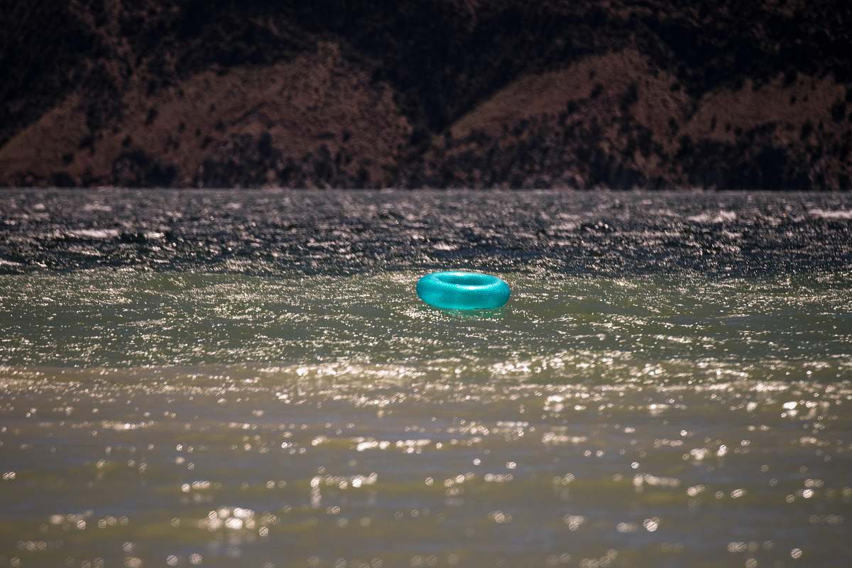 water blue plastic round lid on water flaming gorge reservoir